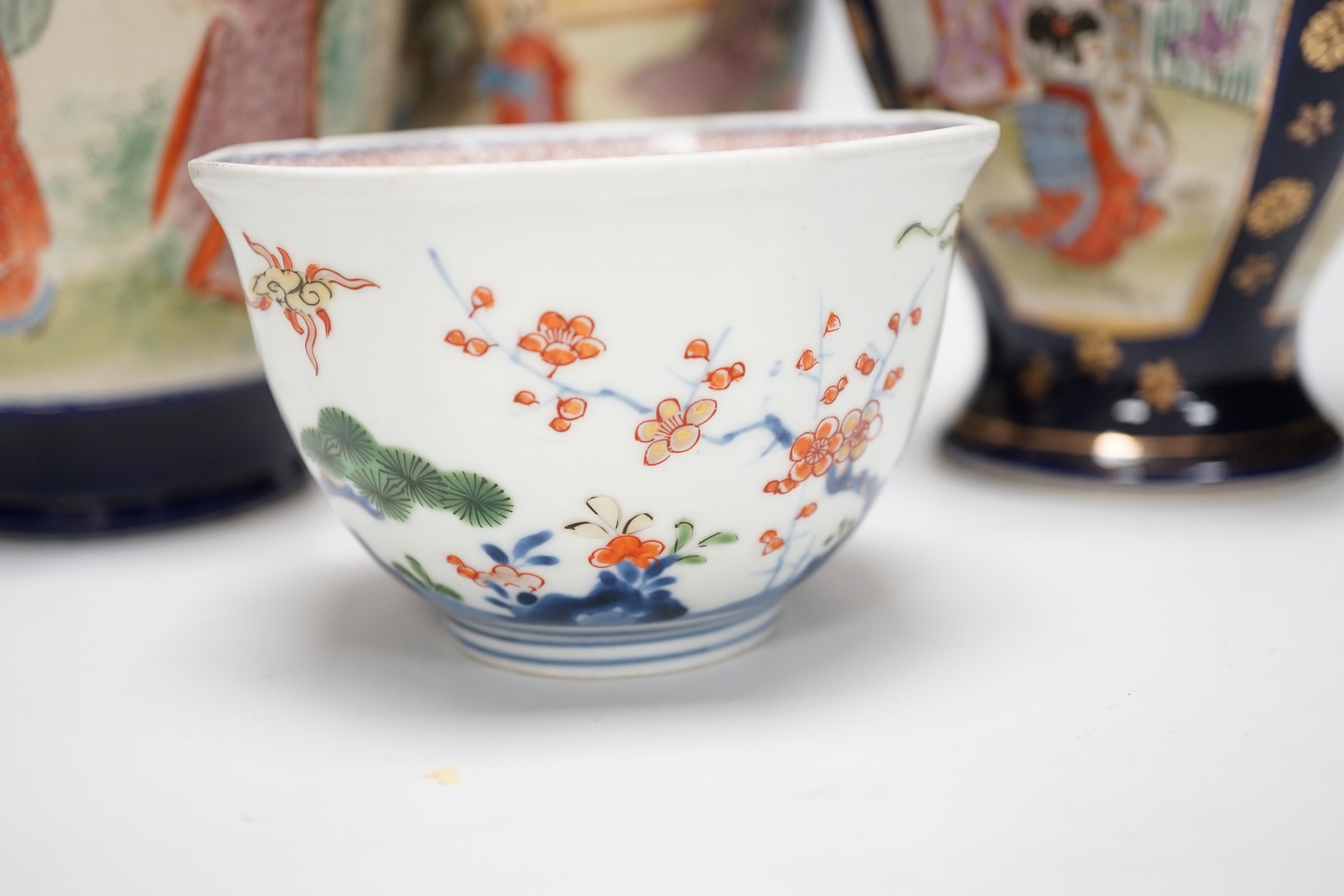 A Japanese Kakiemon bowl and three Satsuma pottery vases, tallest 24cm